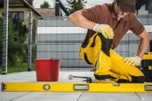 Contractor leveling concrete patio